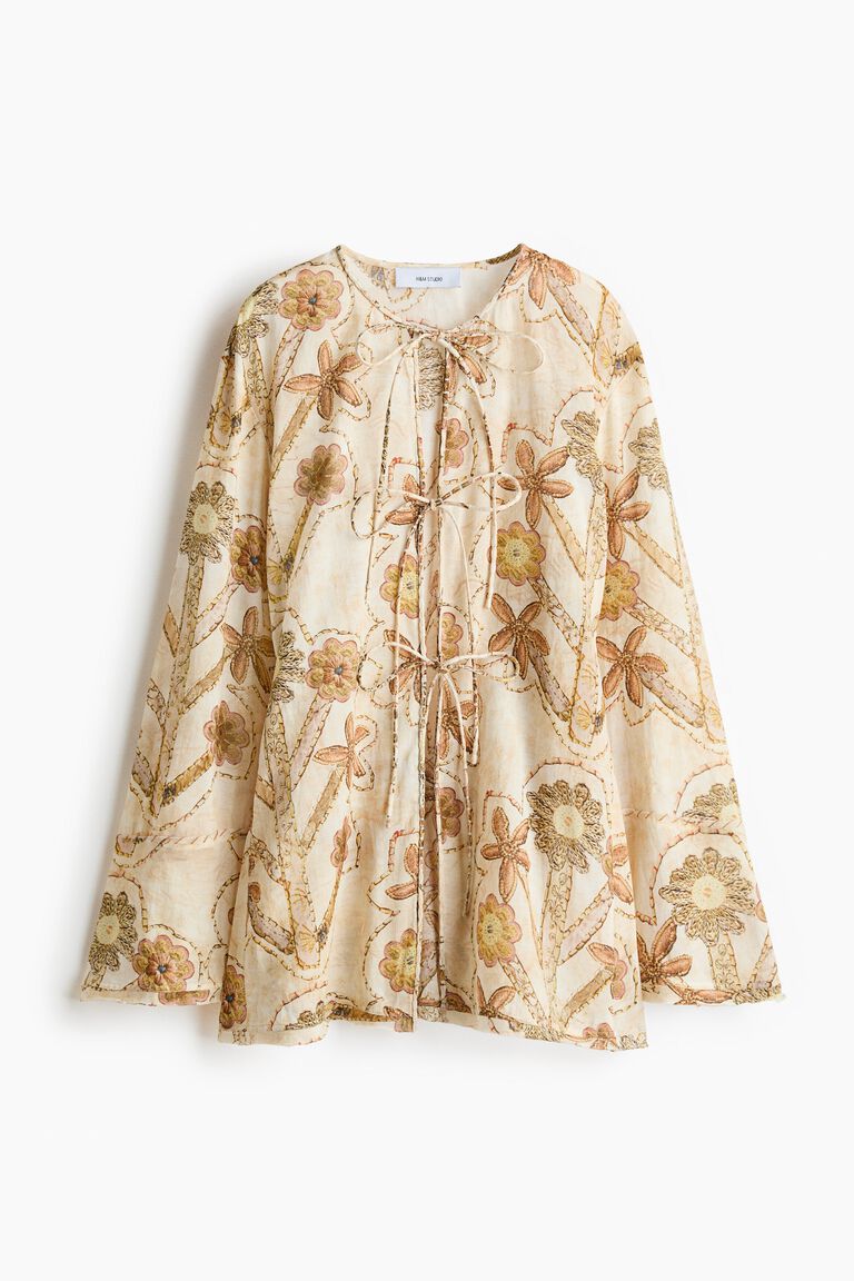 Blus ikat depan dengan motif bunga
